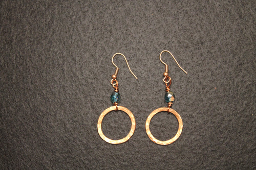 Copper hammered circle drop earrings with teal crystal bead accent and copper fish hook wires